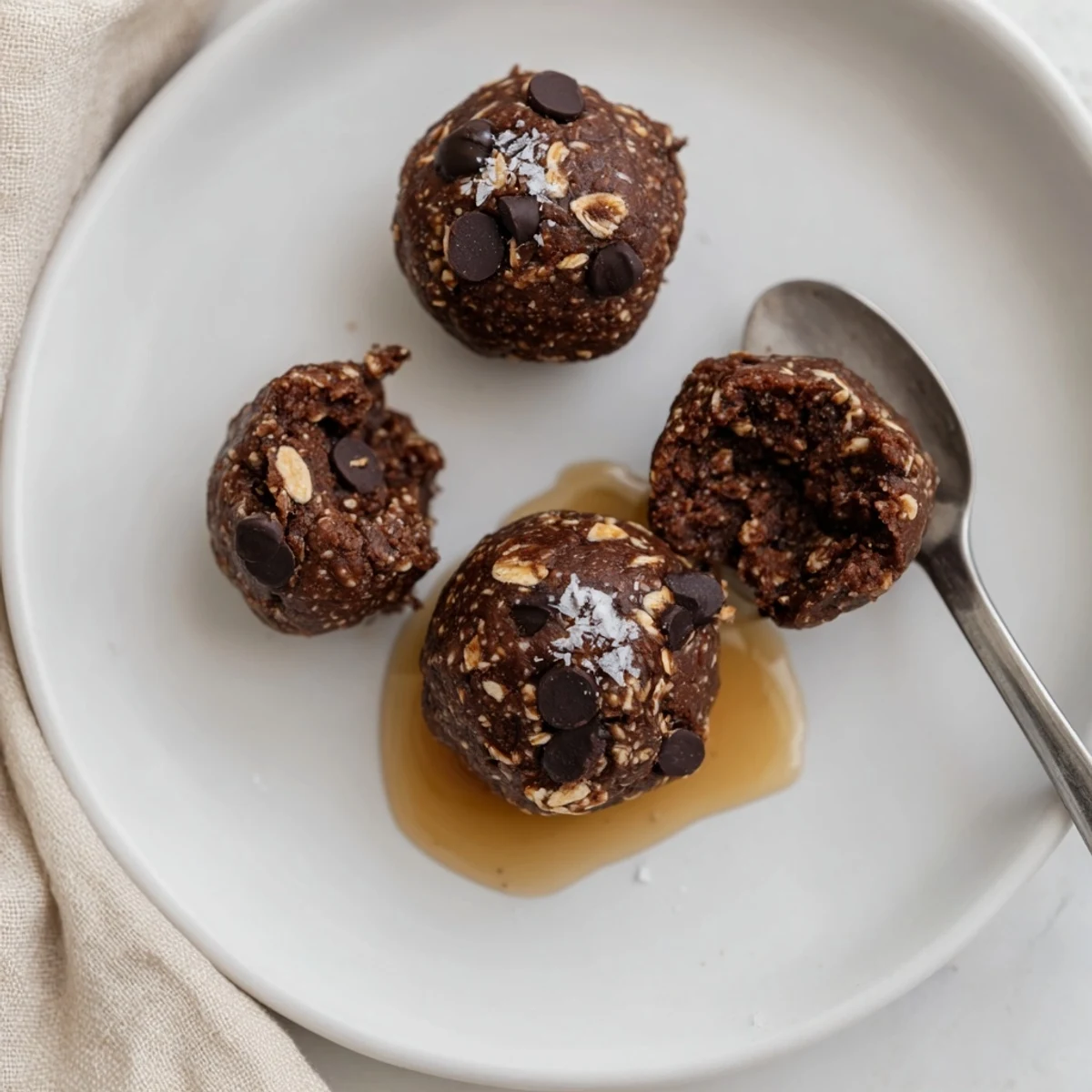 Chewy Brownie Protein Bites studded with dark chocolate chips, perfect post workout