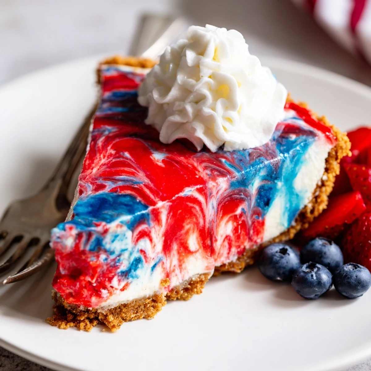 Chilled Patriotic Red White And Blue Swirl Pie topped with whipped cream, berries