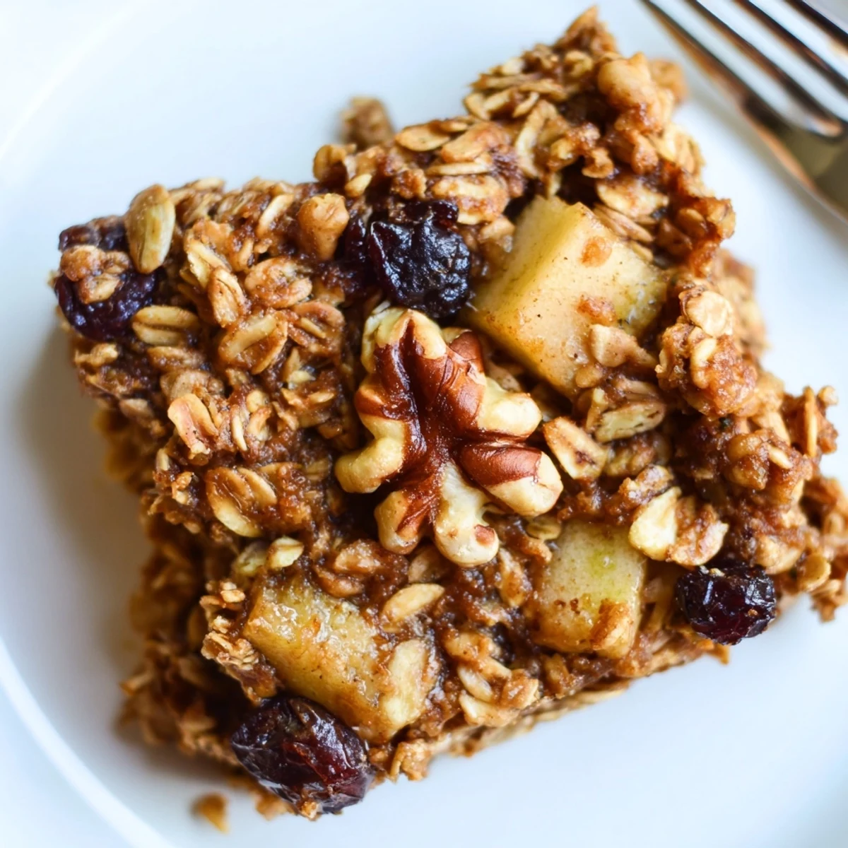 Delicious Apple Cinnamon Oatmeal Bake Recipe For Mornings served warm with creamy yogurt