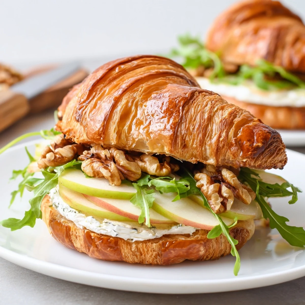Apple Goat Cheese Croissant Sandwich with crisp apple slices and peppered arugula.