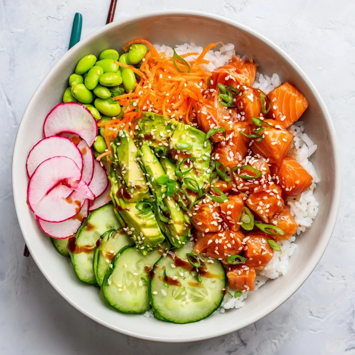Vibrant salmon and avocado poke bowl featuring seasoned rice and colorful fresh vegetables